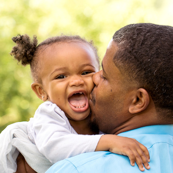 father caring for infant child